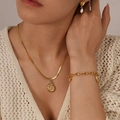 Detail view of gold ocean shell necklace and pearl earrings on knit clothing - Nautilus Pendant Snake Chain Necklace (GX2473)