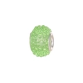Macro detail of mint green resin bead with sparkling rhinestones and silver core - Green