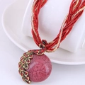 Bohemian style peacock pendant necklace with red resin bead and sparkling rhinestones - Red
