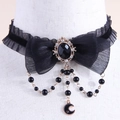 Gothic black lace choker with pearl bow, gem pendant and hanging star moon charms - Black Bow