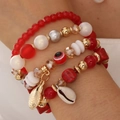 Böhmisches mehrlagiges Perlenarmband mit Muschelanhänger und bunten Evil Eye Perlen - Rot