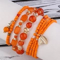 Böhmisches mehrlagiges elastisches Perlenarmband mit orangefarbenen Kristallen und Blatt - Orange