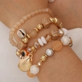 Boho 4er-Set Perlenarmbänder mit goldenen Muschelanhängern und Evil Eye Detail - Kaffeebraun