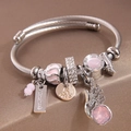 Verstellbarer gedrehter Armreif in Silber mit rosa Kristallen und Engelsflügeln - Rosa