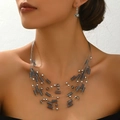 Detail of layered bohemian necklace with grey resin beads and matching drop earrings - Gray