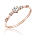 Close-up of elegant rose gold ring featuring seven sparkling round cut white stones - US 6 / Rose Gold