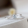 Elegant silver ring with a square-cut aquamarine gemstone and diamond side accents - US 6 / Aqua Blue Zircon