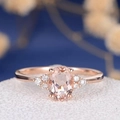 Exquisite rose gold oval pink gemstone ring with diamond accents on a floral background - Rose Gold - Pink Zirconia / US 6
