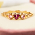 Exquisite gold plated heart ring with red zircons and pink gemstones on a wave band - US 6 / Gold
