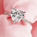 Elegant silver heart ring with sparkling cubic zirconia on soft pink knit background - US 5 / Silver