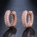 Close-up of rose gold hoop earrings featuring three rows of micro-pave cubic zirconia - Rose Gold