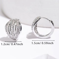 Detailed view of silver shell-shaped hoop earrings with micro-pave cubic zirconia settings - Silver