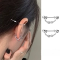 Detail of S925 silver infinity ear cuff with sparkling zircon and screw back closure - Infinity Twist Style (E908-A)