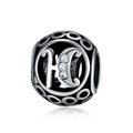Detailed macro view of 925 silver hollow bead with letter H and zircon stones - Letter H