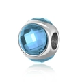 Macro detail of a faceted light blue acrylic cat eye charm bead for DIY jewelry - Lake Blue