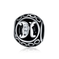 Macro detail of vintage S925 silver charm bead featuring an openwork letter K with crystals - Letter K