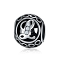 Macro view of vintage silver hollow round charm with letter L and inset zircon stones - L