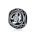 Close-up of vintage hollow silver charm bead with letter R and zircon stones - Letter R