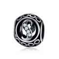 Detailed macro view of the hollow metal charm featuring letter S with sparkling zircons - S