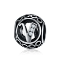 Macro shot of silver alloy charm bead with letter V and white zircon stones - Letter V