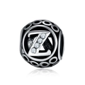 Macro shot of silver hollow charm bead featuring letter Z with inlaid zircon stones - Letter Z