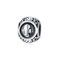 Macro detail of silver charm bead with relief profile and star cut-out patterns - Virgo