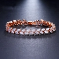Macro detail of rose gold marquise-cut zircon leaf bracelet with fold-over clasp closure - Rose Gold Adjustable