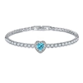 Detailed macro of a heart-shaped blue zircon tennis bracelet in polished silver setting - Light Blue Zirconia