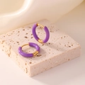 Minimalist gold hoop earrings with purple enamel coating on a textured stone base - Purple
