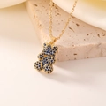 Golden bear necklace pendant with dark blue zircon stones on elegant silk backdrop - Gold Royal Blue