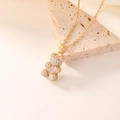 Golden teddy bear pendant necklace with sparkling zircons on elegant stone surface - 08 Gold With White Zirconia