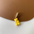 Macro shot of yellow resin gummy bear pendant with gold-plated cubic zirconia bail - Micropaved Yellow Bear Pendant