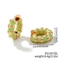 Bamboo style hoop earrings with light green enamel and golden metal accents - Cyan