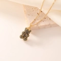 Collana elegante con ciondolo a forma di orsetto dorato e zirconi neri su seta e pietra - Oro Nero