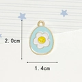 Macro shot of egg-shaped enamel pendant with smiley flower and 2.0cm size dimensions - One Flower Blue Egg