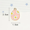 Detailed macro view of pink enamel Easter egg charm with gold trim and size dimensions - Three Flowers Pink Egg