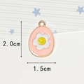 Pink egg-shaped enamel pendant with white flower and yellow smiley face, 2.0x1.5cm - Pink Flower Egg