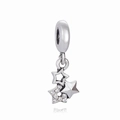Macro shot of silver triple star charms with sparkling cubic zirconia on white base - White