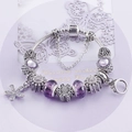 Etnische snake chain armband met paarse glazen kralen en zilveren bloemenhangers - S / Paarse Zonnebloem Stijl