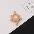Macro view of gold-plated hollow floral pendant with micro-set zircons and dual loops - 2# Hollow Floral Shape