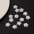 Macro shot of iridescent mermaid pearl star flatback beads for DIY resin crafts - Medium