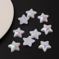 Macro shot of colorful aurora AB coating star-shaped acrylic beads on dark background - Large