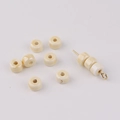 Detail of cream ceramic abacus beads showing texture and hole for jewelry DIY crafts - Beige
