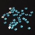 Detailed close-up of 2mm light blue square acrylic rhinestones with silver flat back - Mini Size / Light Blue