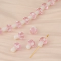 Macro view of pink mushroom glass beads for handmade DIY jewelry crafting accessories - Pink