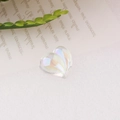 Macro detail of a heart-shaped resin bead with iridescent rainbow AB coating for DIY crafts - 2# Heart