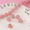 Detailed close-up of pink glass strawberry charms for handmade jewelry making - Single Bead / Pink