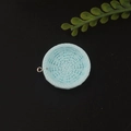 Detail shot of light blue resin woven-texture round charm with golden ring for DIY jewelry - Round Blue