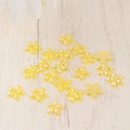 Macro detail of yellow resin 5-petal flowers with iridescent pearl finish for DIY nail art - Yellow