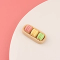 Miniature resin macarons in pink, yellow, and green colors on a small tray detail - Tricolor Macaron Style (C0035)